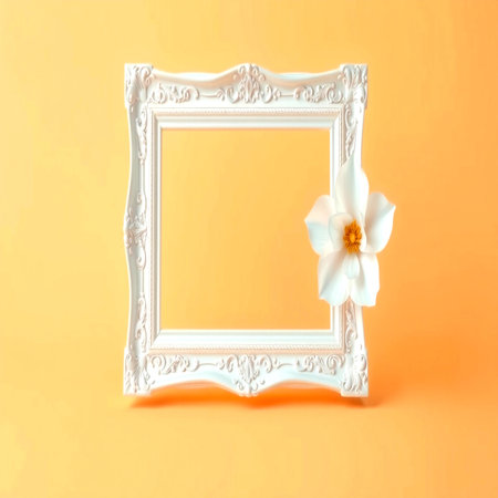 White picture frame with white flower on orange background. Minimal style.の写真素材