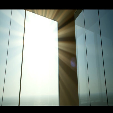 Window of a modern office building with sunbeams and lens flareの写真素材