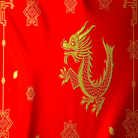 Golden dragon on the red cloth as a symbol of prosperity and wealthの写真素材