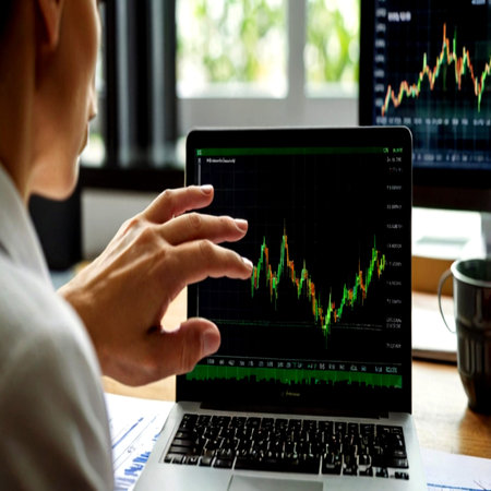 Businessman analyzing investment charts with laptop. Stock market or forex trading concept.