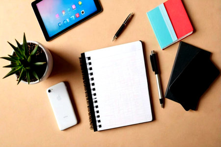 Office desk table with smartphone, notebook and tablet. Top view with copy space