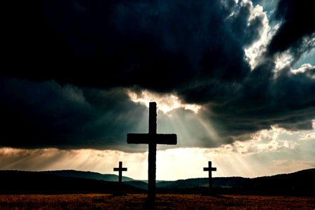 Cross silhouette with dramatic sky and sun rays. Cross symbol of Jesus Christ.