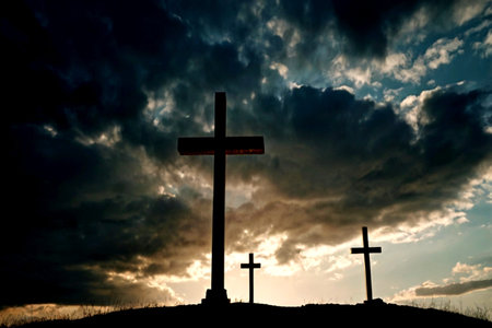 Crosses silhouette at sunset with cloudy sky background. Christian symbols.