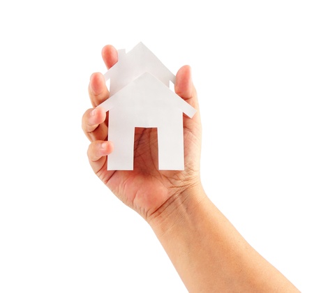 Close up of human hand bring a house paper of propertyの写真素材