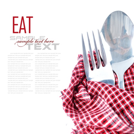 Close up of a silver knife and fork on a white background (with sample text)の写真素材