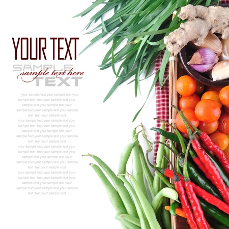 Tomatos, chives, garlic, red chili, ginger and long bean on white background  with sample text の写真素材