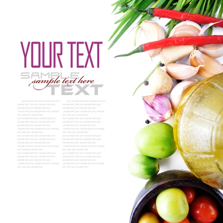 Tomatos, chives, garlic, red chili, and olive oil on white background  with sample text の写真素材