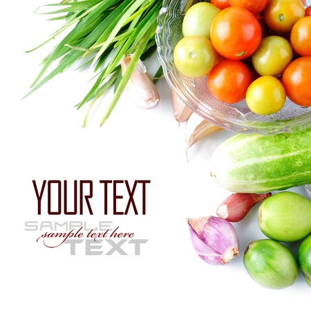 Tomatos, chives garlic, onion and cucumbers on white background  with sample text の写真素材