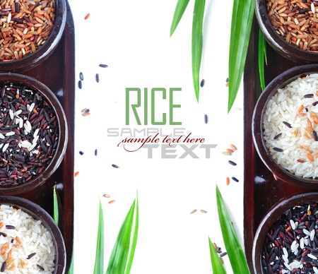Bowls of uncooked rice over white with sample textの写真素材