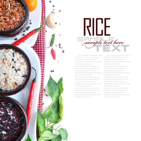 Bowls of uncooked rice over white with sample textの写真素材