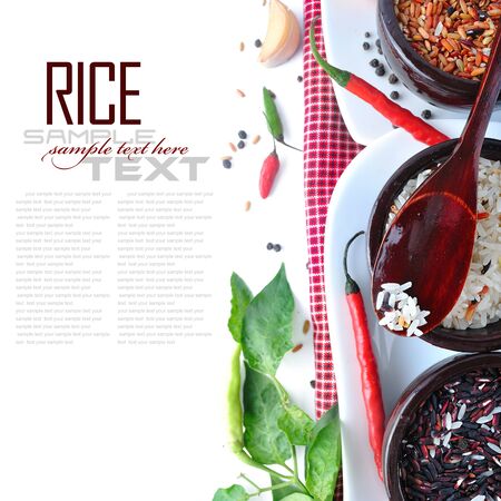 Bowls of uncooked rice over white with sample textの写真素材