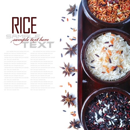 Bowls of uncooked rice over white with sample textの写真素材