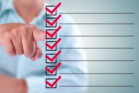 business man designed on a checklist box. With red checklistの写真素材