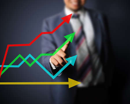 Business man touching curve of growthの写真素材