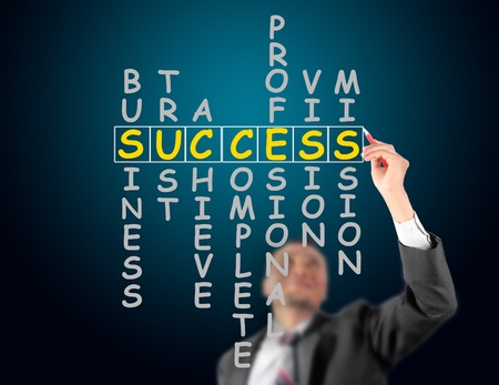 Business man writing success crosswordの写真素材