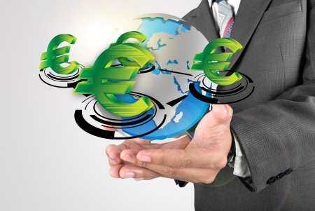 Business man holding euro money icon in the worldの写真素材