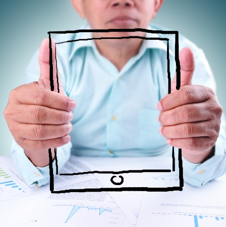 Businessman showing tablet computer の写真素材