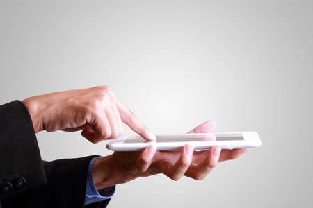 Unrecognizable business man holding a digital tablet の写真素材