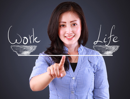 business woman showing balncing concept work and lifeの写真素材