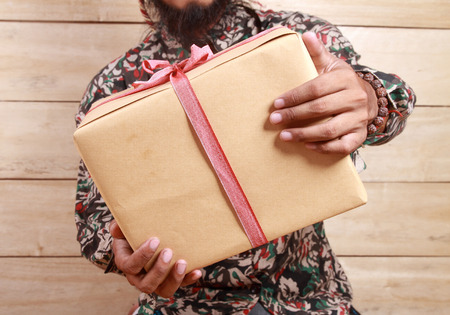 man holding a giftの写真素材