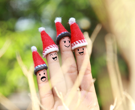 Christmas background with human finger conceptの写真素材