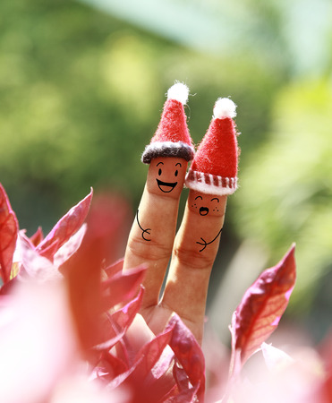 Christmas background with human finger conceptの写真素材