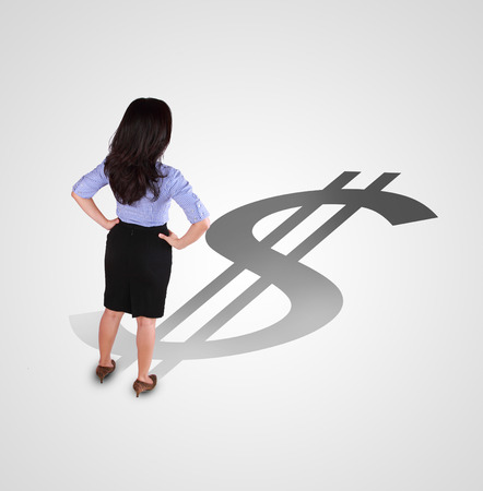 business woman standing with different direction shadowの写真素材