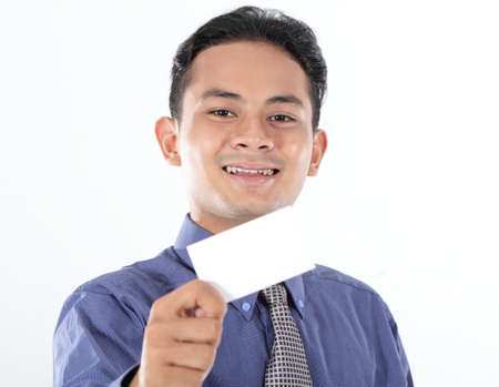Young businessman show blank business cardの写真素材