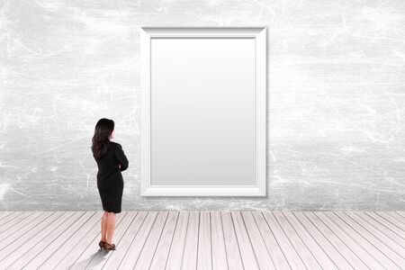 blank frame on a white background with business womanの写真素材