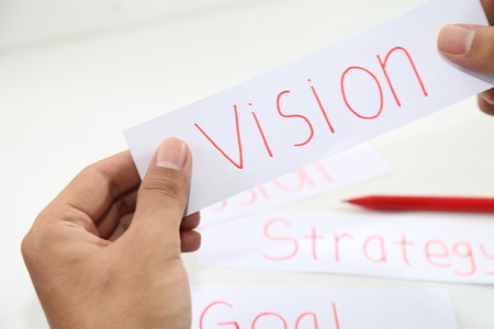 business hand writing a piece of vision paperの写真素材