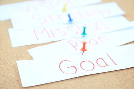 a piece of business paper with paper pinの写真素材