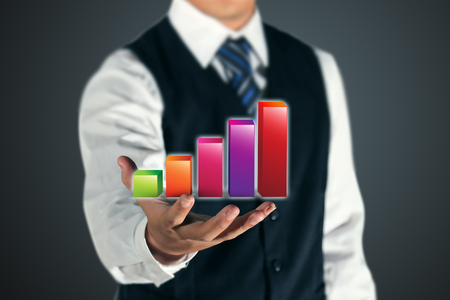 businessman showing 3D profit graphの写真素材