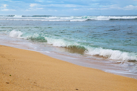 Beautiful sandy beach and waves of the Mediterranean Sea in Israel.