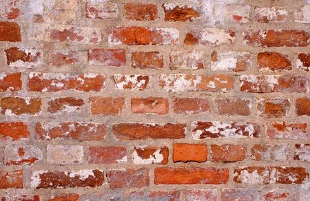 Vintage shabby colorful brick wall as a backgroundの写真素材