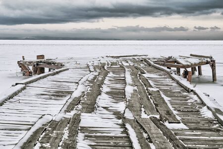Berth fishing boats on the lake in winterの写真素材