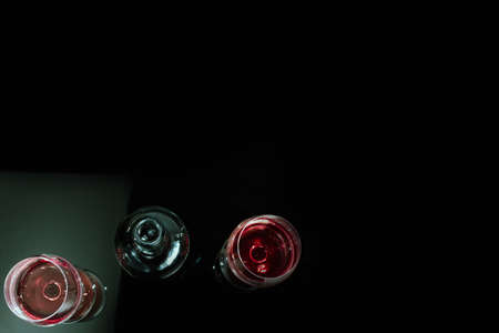 Red wine in glass on black backgroundの写真素材