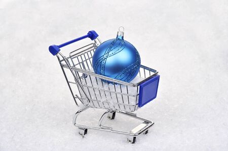 shopping cart with blue christmas ballの写真素材