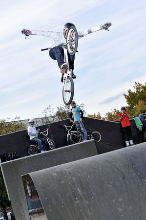 High jump on a bmx bike in a skateparkの写真素材