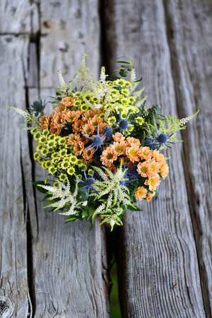 Bouquet of flowers on a wooden background. Selective focus.の写真素材