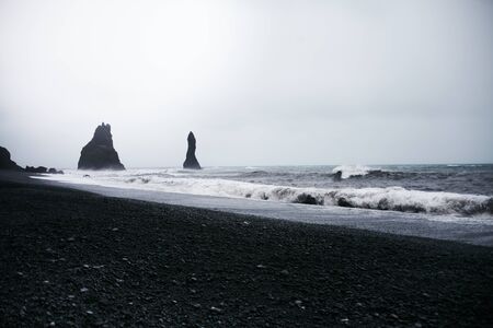 Sea Stacks and Basalt Clifs to the East of Reynisfjara Black Sand Beach, near Vik in Southern...