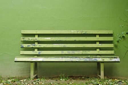 Green Bench with green wall.の写真素材