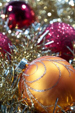 Orange and red Christmas baubles.の写真素材