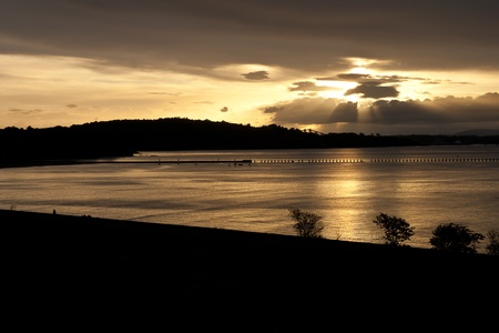 Black and golden sunset at the bay.の写真素材