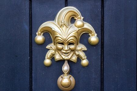 Harlequin or Joker Mask as an elaborate door knockerの写真素材