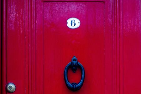 House number 6 on a lucky red doorの写真素材