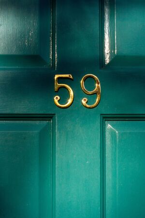 Golden metal digits form house number 59の写真素材