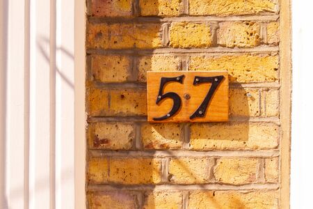 House number 57 on a brick wallの写真素材