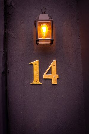House number 14 lit from aboveの写真素材