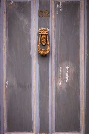 An old wooden front door being renovatedの写真素材