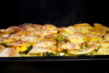 Baked french potatoes with vegetableの写真素材